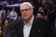 Former Los Angeles Lakers head coach and current New York Knicks president Phil Jackson stands with Linda Rambis, left, as they attend the NBA Basketball game between the New York Knicks and Los Angeles Lakers, Thursday, March 12, 2015, in Los Angeles. The Knicks won 101-94. (AP Photo/Danny Moloshok)