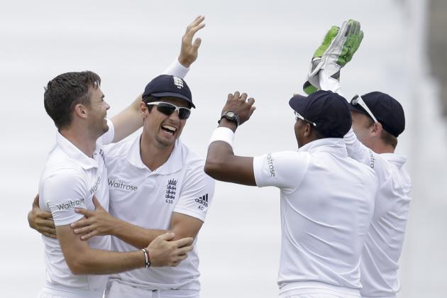 England's James Anderson, left, is congratulated by team captain Alistair Cook, second from left, Chris Jordan, second from right, and Jos Buttler on day one of their second Test match at the National Stadium in St. George's, Grenada, Tuesday, April 21, 2015. (AP Photo/Ricardo Mazalan)