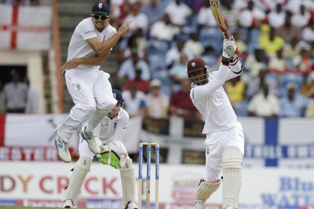 England captain Alistair Cook jumps to avoid being hit by a shot played by West Indies' Marlon Samuels, right, from a delivery of Moeen Ali during day one of their second Test match at the National Stadium in St. George's, Grenada, Tuesday, April 21, 2015. (AP Photo/Ricardo Mazalan)