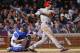 Apr 14, 2015; Chicago, IL, USA; Cincinnati Reds first baseman Joey Votto (19) hits a double against the Chicago Cubs during the fifth inning at Wrigley Field. Mandatory Credit: Kamil Krzaczynski-USA TODAY Sports