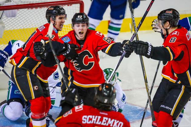 Apr 19, 2015; Calgary, Alberta, CAN; Calgary Flames center Sam Bennett (63) celebrates his goal with teammates against the Vancouver Canucks during the third period in game three of the first round of the 2015 Stanley Cup Playoffs at Scotiabank Saddledome. Calgary Flames won 4-2. Mandatory Credit: Sergei Belski-USA TODAY Sports