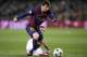 Barcelona's Lionel Messi, left, escapes PSG's Marco Verratti during the Champions League quarterfinal second leg soccer match between FC Barcelona and Paris Saint Germain at the Camp Nou Stadium in Barcelona, Spain, Tuesday, April 21, 2015. (AP Photo/Manu Fernandez)