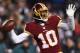 LANDOVER, MD - DECEMBER 20: Quarterback Robert Griffin III #10 of the Washington Redskins throws a pass in the second half against the Philadelphia Eagles at FedExField on December 20, 2014 in Landover, Maryland. The Washington Redskins won, 27-24. (Photo by Patrick Smith/Getty Images)