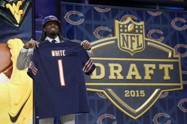 West Virginia wide receiver Kevin White poses for photos after being selected by the Chicago Bears as the seventh pick in the first round of the 2015 NFL Draft,  Thursday, April 30, 2015, in Chicago. (AP Photo/Charles Rex Arbogast)