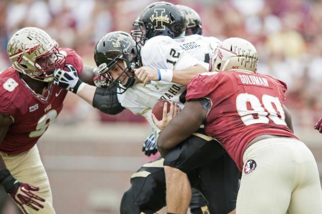 TALLAHASSEE, FL - NOVEMBER 23: Eddie Goldman #90 of the Florida State Seminoles sacks Taylor Davis #12 of the Idaho Vandals during the first half at Doak Campbell Stadium on November 23, 2013 in Tallahassee, Florida. (Photo by Jeff Gammons/Getty Images)