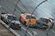 Austin Wayne Self, right, spins into Brad Smith (48) as Bobby Gerhart (5) passes them in the tri-oval during the ARCA Series auto race at Talladega Superspeedway, Friday, May 1, 2015, in Talladega, Ala. (AP Photo/Butch Dill)