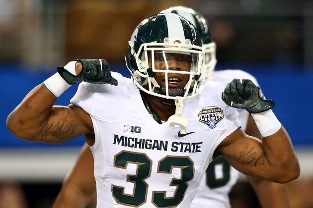ARLINGTON, TX - JANUARY 01:  Jeremy Langford #33 of the Michigan State Spartans celebrates his touchdown against the Baylor Bears during the first half of the Goodyear Cotton Bowl Classic at AT&T Stadium on January 1, 2015 in Arlington, Texas.  (Photo by Ronald Martinez/Getty Images)