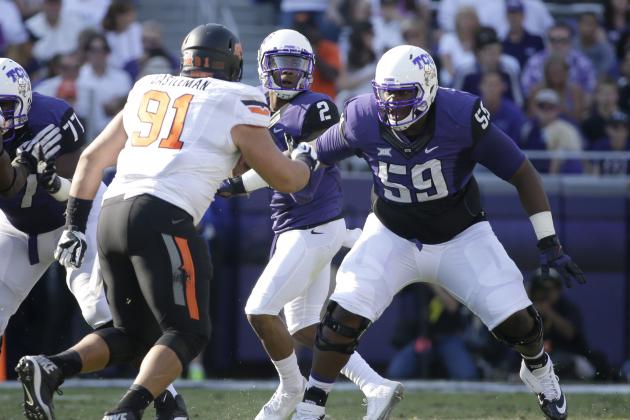 TCU offensive tackle Tayo Fabuluje (59) defends against a rush by Oklahoma State defensive tackle James Castleman (91) during an NCAA college football game, Saturday, Oct. 18, 2014, in Fort Worth, Texas. (AP Photo/Tony Gutierrez)
