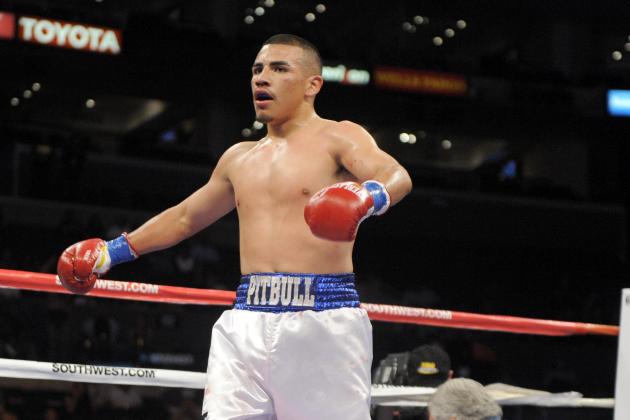 Frankie Gomez, left, celebrates his knockout of Ricardo Calzada during the third round of an welterweight boxing match in Los Angeles, Saturday, Sept. 18, 2010. (AP Photo/Chris Carlson)
