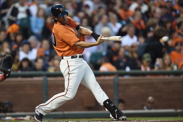 SAN FRANCISCO, CA - AUGUST 15:  Madison Bumgarner #40 of the San Francisco Giants hits a base hit against the Philadelphia Phillies in the bottom of the third inning at AT&T Park on August 15, 2014 in San Francisco, California.  (Photo by Thearon W. Henderson/Getty Images)