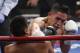 Leo Santa Cruz, of Rosemead, Calif., right, hits Jose Cayetano, of Mexico, during their featherweight fight on Saturday, May 2, 2015 in Las Vegas. (AP Photo/Eric Jamison)