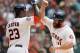 HOUSTON, TX - MAY 03: Evan Gattis #11 of the Houston Astros receives a high five from Chris Carter #23 after hittinga home run in the eighth inning against the Seattle Mariners at Minute Maid Park on May 3, 2015 in Houston, Texas. (Photo by Bob Levey/Getty Images)