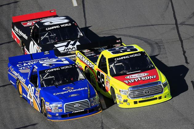 MARTINSVILLE, VA - MARCH 28: Joey Logano, driver of the #29 Cooper Standard Ford, and Matt Crafton, driver of the #88 Hormel/Menards Toyota, race in front of Cole Custer, driver of the #00 Haas Automation Chevrolet, during the NASCAR Camping World Truck Series Kroger 250 at Martinsville Speedway on March 28, 2015 in Martinsville, Virginia. (Photo by Rob Carr/Getty Images)