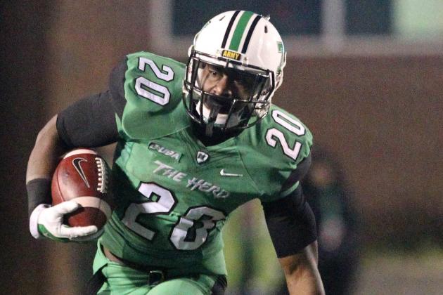 Nov 15, 2014; Huntington, WV, USA;  Marshall Thundering Herd running back Steward Butler (20) breaks for a long run during the fourth quarter of the game against the Rice Owls at Joan C. Edwards Stadium. Mandatory Credit: Rob Leifheit-USA TODAY Sports