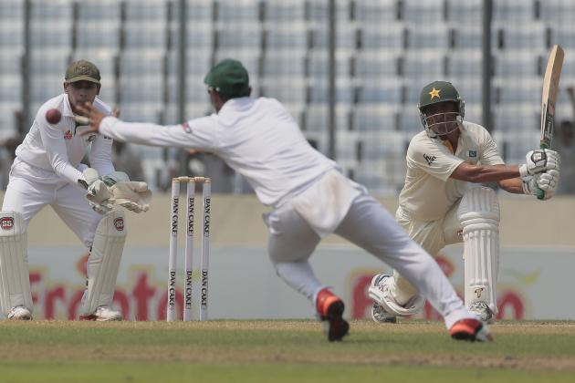 Pakistan’s Younis Khan, right, plays a shot, as Bangladesh’s Shuvagata Hom, center, attempts to catch the ball and captain Mushfiqur Rahim watches during the first day of their second test cricket match in Dhaka, Bangladesh, Wednesday, May 6, 2015. (AP Photo/ A.M. Ahad)