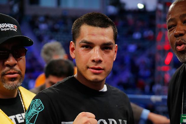 LOS ANGELES, CA - APRIL 26:  Omar Figueroa Jr. celebrates his decision win over Jerry Belmontes during their WBC Lightweight World Championship title bout at StubHub Center on April 26, 2014 in Los Angeles, California.  (Photo by Joe Scarnici/Getty Images)