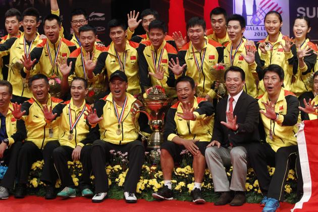 China's badminton team pose for photographers on the podium after defeating South Korea in their final match at the Sudirman Cup world mixed team badminton championships in Kuala Lumpur, Malaysia, Sunday, May 26, 2013. (AP Photo/Lai Seng Sin)