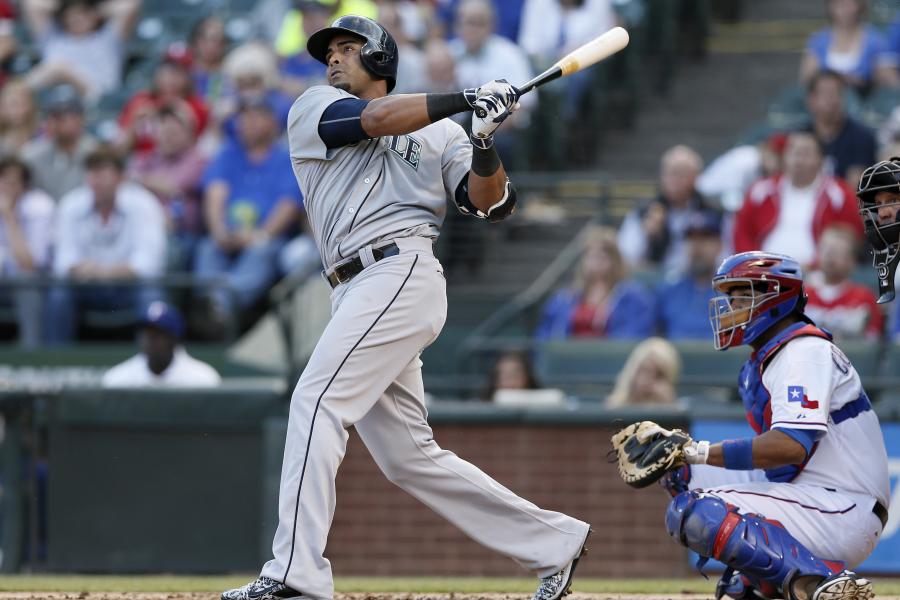 Seattle Mariners' Nelson Cruz holds his bat in the dugout during the fifth  inning of a baseball game against the Los Angeles Angels Saturday, April 8,  2017, in Anaheim, Calif. (AP Photo/Jae