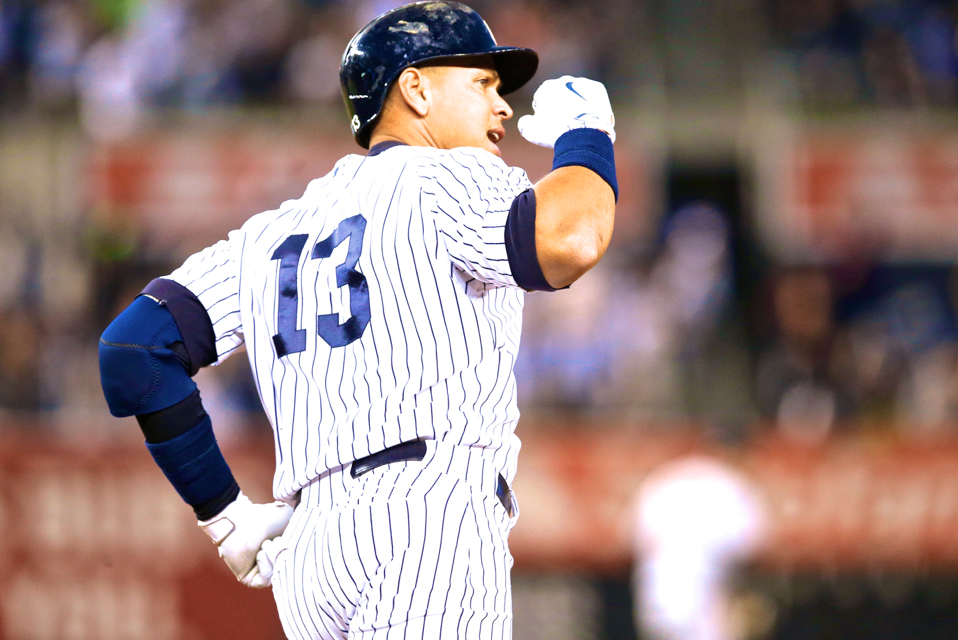 New York Yankees' Alex Rodriguez grits his teeth after taking