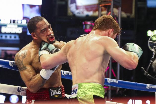 May 9, 2015; Houston, TX, USA;  James Kirkland (left) and Canelo Alvarez (right) fight in a super welterweight bout at Minute Maid Park. Alvarez defeated Kirkland with a knockout in the third round. Mandatory Credit: Troy Taormina-USA TODAY Sports