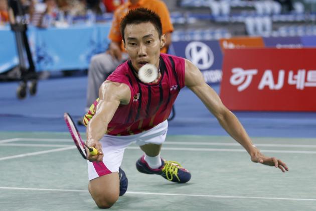 Malaysia's Lee Chong Wei returns a shot to China's Lin Dan during the men's singles semi-final badminton match at the 17th Asian Games in Incheon, South Korea, Sunday, Sept. 28, 2014.  (AP Photo/Kin Cheung)