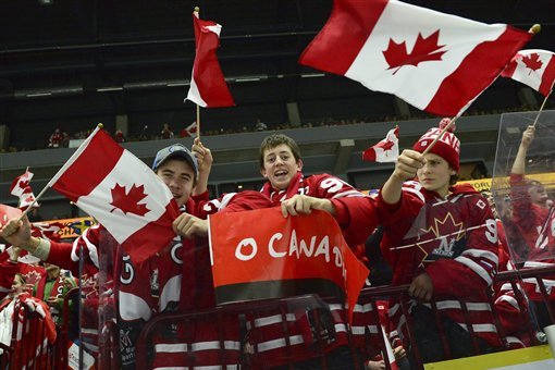 Canadian fans cheer prior to the World Junior Hockey Championships semifinal between Canada and Finland at Malmo Arena in Malmo, Sweden on Saturday, Jan. 4, 2014. (AP Photo / TT News Agency / Ludvig Thunman) SWEDEN OUT
