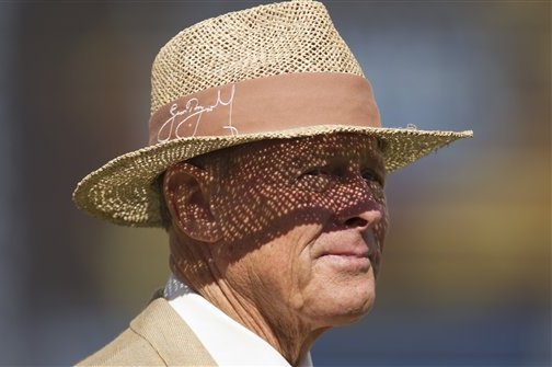 Former England cricketer Geoff Boycott stands on the pitch before play on the third day of the third Ashes Test series cricket match between England and Australia at Old Trafford cricket ground, Manchester, England, Saturday, Aug. 3, 2013. (AP Photo/Jon Super)