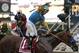 Jockey Victor Espinoza, celebrates aboard American Pharoah after winning the 140th Preakness Stakes horse race at Pimlico Race Course, Saturday, May 16, 2015, in Baltimore. (AP Photo/Brynn Anderson )