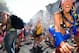 FILE - In this May 17, 2009 file photo, participants have water sprayed on them as they ascend the Hayes Street hill during the 98th running of the Bay to Breakers race in San Francisco. Over the past 100 years, San Francisco's Bay to Breakers footrace has evolved from a wholesome, modest-size athletic event into a rowdy spectacle featuring tens of thousands of runners and spectators -- some costumed, others nude and many rip-roaring drunk. As the event prepares to celebrate its centennial Sunday, May 15, 2011, organizers are hoping a new zero-tolerance alcohol policy will help usher in a more responsible, sponsor-friendly era. (AP Photo/Darryl Bush, File)