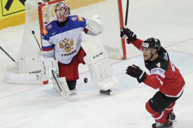 Russia’s goalkeeper Sergei Bobrovski, left, reacts missing team's third goal from Canada’s Canada’s Sidney Crosby, unseen, during the Hockey World Championships gold medal match in Prague, Czech Republic, Sunday, May 17, 2015. (AP Photo/Sergei Grits)