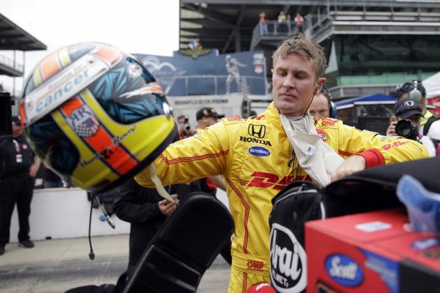 Ryan Hunter-Reay removes his helmet after he qualified on the first day of qualifications for the Indianapolis 500 auto race at Indianapolis Motor Speedway in Indianapolis, Saturday, May 16, 2015.  (AP Photo/AJ Mast)