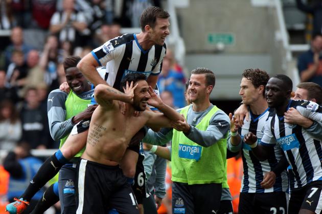 Newcastle United's Jonas Gutierez foreground, center left,  celebrates his goal with his teammates,  during the English Premier League soccer match between Newcastle United and West Ham United's  at St James' Park, Newcastle, England, Sunday, May 24, 2015. (AP Photo/Scott Heppell)