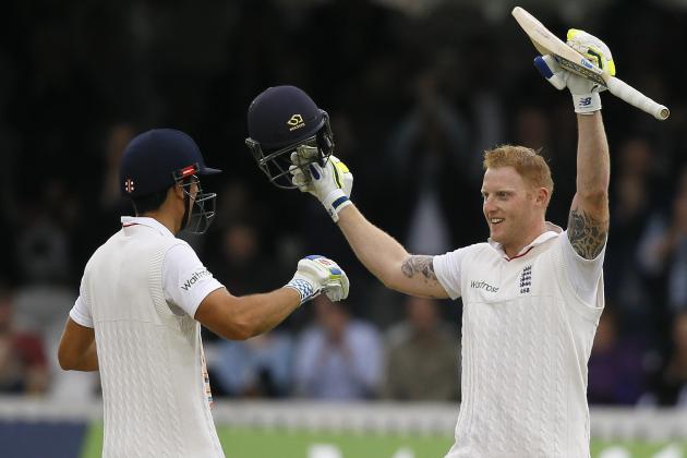 England's Ben Stokes, right, walks to captain Alastair Cook as he celebrates his century during the fourth day of the first Test match between England and New Zealand at Lord's cricket ground in London, Sunday, May 24, 2015. (AP Photo/Kirsty Wigglesworth)