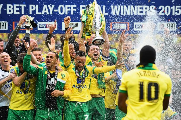LONDON, ENGLAND - MAY 25: Cameron Jerome of Norwich City (10) sprays his team mates with champagne in celebration after the Sky Bet Championship Playoff Final between Middlesbrough and Norwich City at Wembley Stadium on May 25, 2015 in London, England. Norwich City seal promotion to the Premier League with a 2-0 victory (Photo by Laurence Griffiths/Getty Images)