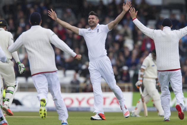 England's James Anderson, centre, celebrates his 400th test wicket after taking the wicket of New Zealand's Martin Guptill, caught by Ian Bell for 0, on the first day of the second Test match between England and New Zealand at Headingley cricket ground in Leeds, England, Friday, May 29, 2015.(AP Photo/Jon Super)