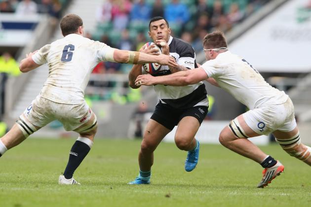 LONDON, ENGLAND - MAY 31:  Tusi Pisi of the Barbarians is tackled by Mark Wilson (L) and Jack Clifford durng the Rugby International match between England and the Barbarians at Twickenham Stadium on May 31, 2015 in London, England.  (Photo by David Rogers/Getty Images)