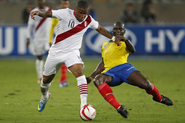 Peru's Jefferson Farfan, left, fights for the ball with Ecuador's Segundo Castillo during a 2014 World Cup qualifying soccer game in Lima, Peru, Friday, June 7, 2013. (AP Photo/Martin Mejia)
