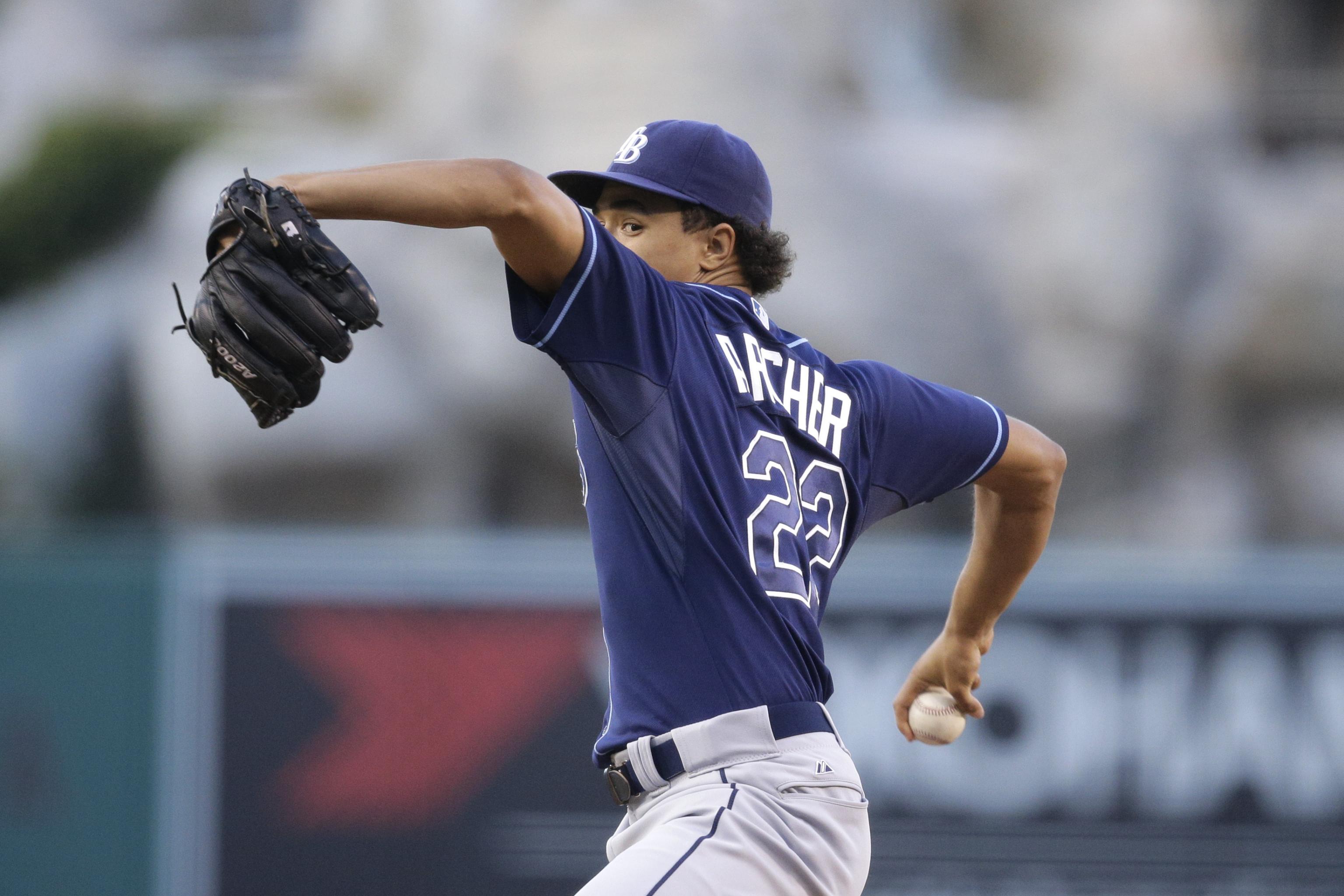 An American professional baseball player, Chris Archer holds a net