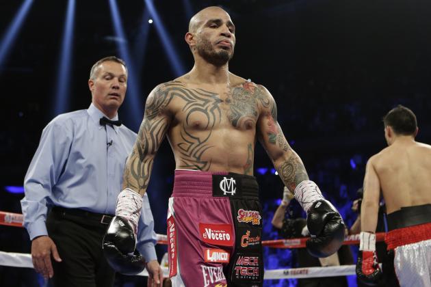 Miguel Cotto, of Puerto Rico, and Sergio Martinez, of Argentina, right, head to their corners after the first round of a WBC World Middleweight Title boxing match Saturday, June 7, 2014, in New York.  (AP Photo/Frank Franklin II)