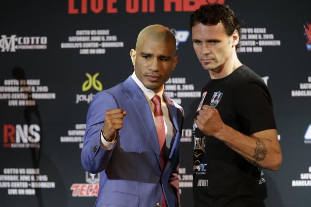 Boxers Miguel Cotto, left, and Daniel Geale pose for photographers during a news conference, Tuesday, June 2, 2015, in New York. Cotto is slated to defend his WBC world middleweight title against Geale on Saturday, June 6, at Barclays Center in the Brooklyn borough of New York.  (AP Photo/Mary Altaffer)