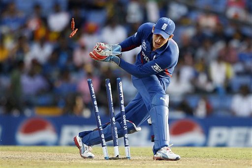 England's wicketkeeper Craig Kieswetter breaks the stumps to run-out New Zealand's batsman James Franklin, not seen, during their ICC Twenty20 Cricket World Cup Super Eight match in Pallekele, Sri Lanka, Saturday, Sept. 29, 2012. (AP Photo/Aijaz Rahi)