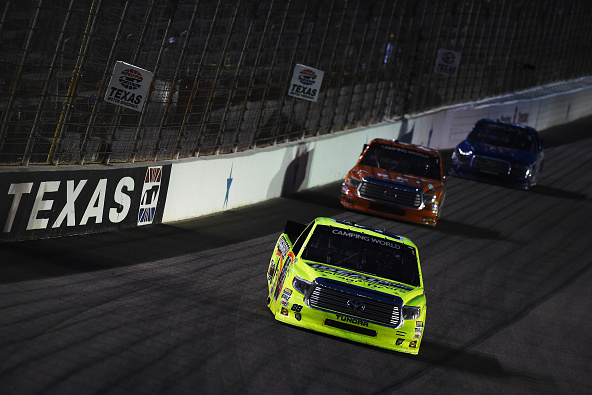 FORT WORTH, TX - JUNE 05: Matt Crafton, driver of the #88 Ideal Door/Menards Toyota, leads a pack of cars during the NASCAR Camping World Truck Series WinStar World Casino & Resort 400 at Texas Motor Speedway on June 5, 2015 in Fort Worth, Texas. (Photo by Rainier Ehrhardt/Getty Images for Texas Motor Speedway)
