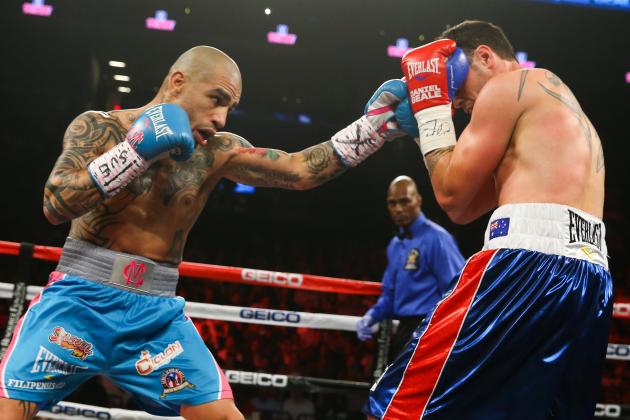 NEW YORK, NY - JUN 6: Miguel Cotto (L) punches Daniel Geale (R) during their WBC middleweight world championship fight at the Barclays Center on June 6, 2015 in the Brooklyn borough of New York City. (Photo by Ed Mulholland/Getty Images)