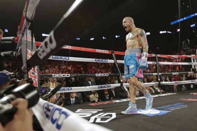 Miguel Cotto, of Puerto Rico, celebrates after defeating Daniel Geale, of Australia, during the fourth round of a boxing match Saturday, June 6, 2015, in New York. (AP Photo/Frank Franklin II)