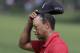 Tiger Woods walks off the 18th green following his final round of the Memorial golf tournament Sunday, June 7, 2015, in Dublin, Ohio. (AP Photo/Darron Cummings)