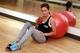 IMAGE DISTRIBUTED FOR POM WONDERFUL - Kacy Catanzaro, competitor on NBC’s summer smash “American Ninja Warrior,” cools down after leading an exclusive “express” workout with her trainer Brent Steffensen at Gravity Gym Tuesday, June 2, 2015 in New York. The power pair created powerfully refreshing smoothie recipes after teaming up with the show’s sponsor, POM Wonderful 100% Pomegranate Juice. “Mighty Kacy” and Brent compete in the show’s Houston qualifying round which airs on NBC on Monday, June 8 at 8 p.m. ET. (Jason DeCrow/AP Images for POM Wonderful)