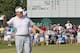 Colin Montgomerie celebrates after sinking a putt on the 18th green to win, during a three-hole aggregate playoff with Gene Sauers in the final round of the U.S. Senior Open golf tournament at Oak Tree National in Edmond, Okla., Sunday, July 13, 2014. (AP Photo/Sue Ogrocki)