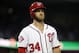 Washington Nationals right fielder Bryce Harper (34) pauses while batting during a baseball game against the Toronto Blue Jays at Nationals Park, Wednesday, June 3, 2015, in Washington. (AP Photo/Alex Brandon)