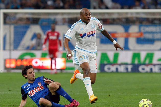 Marseille's Ghanaian forward Andre Ayew, right, runs past Monaco's midfielder Bernardo Silva during a League One soccer match between Marseille and Monaco at the Velodrome Stadium in Marseille, southern France, Sunday, May 10, 2015. (AP Photo/Claude Paris)