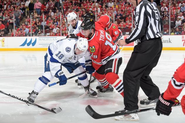 CHICAGO, IL - JUNE 08:  Ondrej Palat #18 of the Tampa Bay Lightning and Jonathan Toews #19 of the Chicago Blackhawks face off during Game Three of the 2015 NHL Stanley Cup Final at the United Center on June 8, 2015 in Chicago, Illinois.  (Photo by Bill Smith/NHLI via Getty Images)